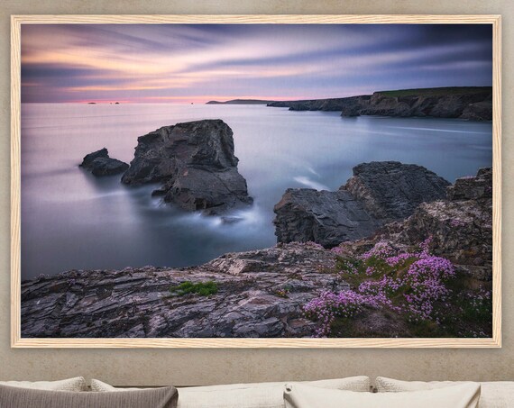 Dramatic Rocky Sea Coast At Dusk With Blooming Wildflowers Poster