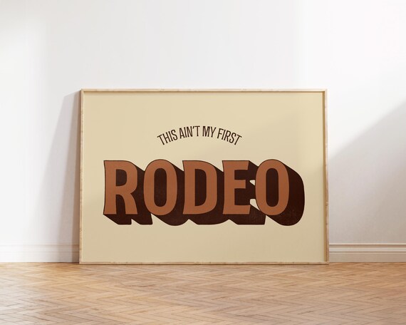 This Ain't My First Rodeo Cream Retro Western Typography Poster