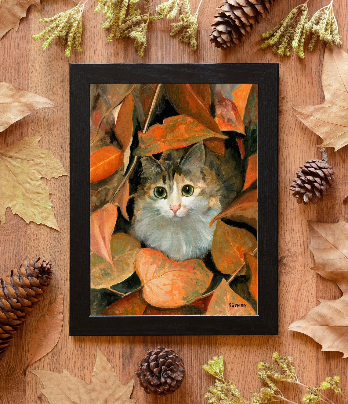 Calico Cat with Green Eyes Hiding among Autumn Leaves Poster - Image 6
