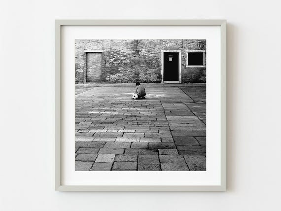 Venice Boy Sitting Beside His Football Wall Art