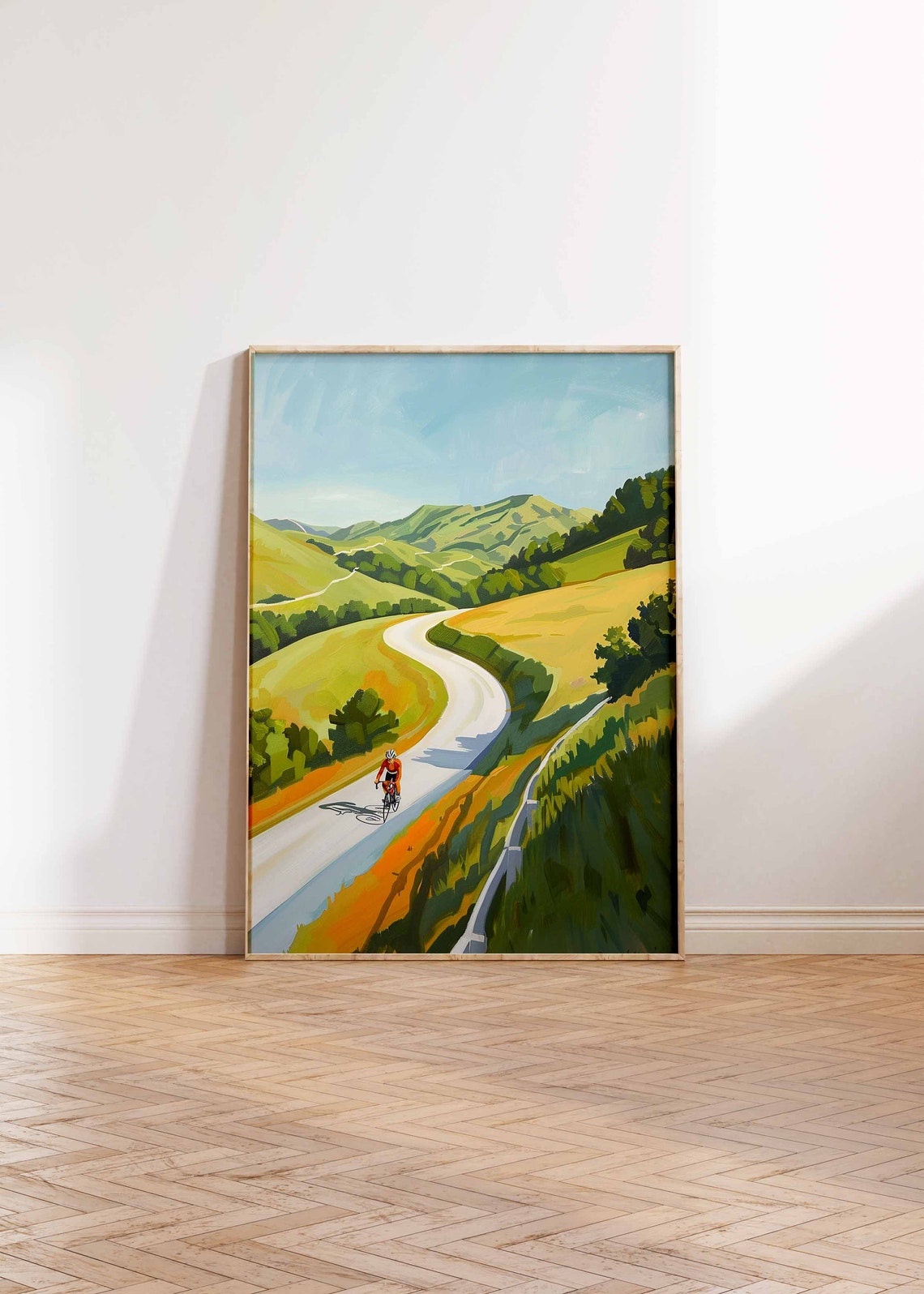 Solo Cyclist Riding Winding Road Through Golden Rolling Hills Poster - Image 2