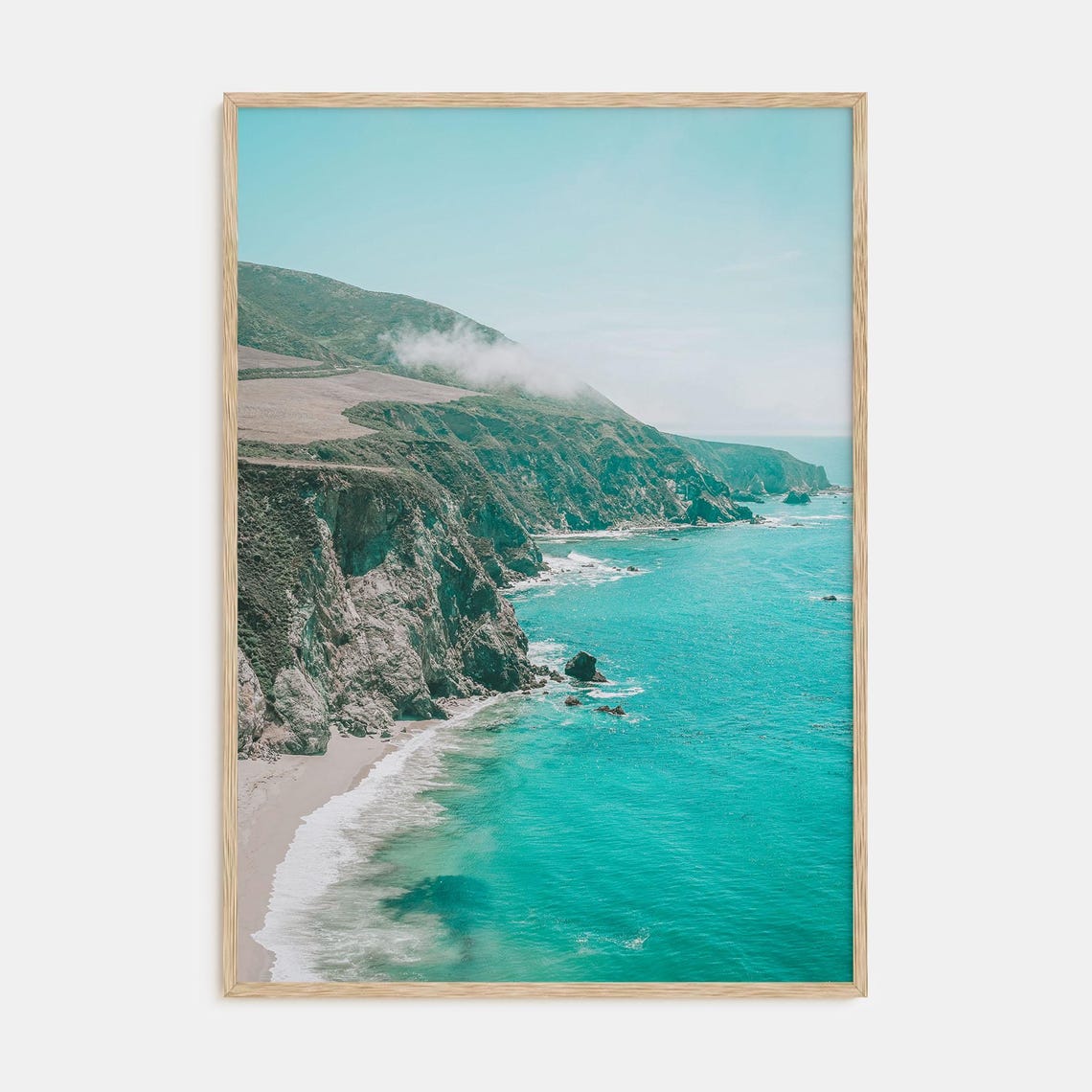Rugged Sea Cliffs and Turquoise Waves on a Misty Coast Poster