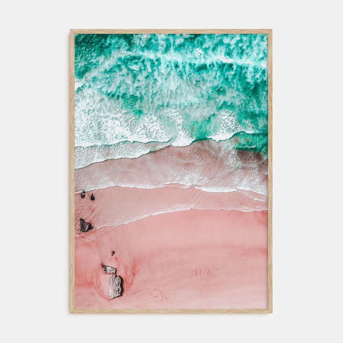 Aerial View of Pink Sand Beach with Turquoise Ocean Waves Poster