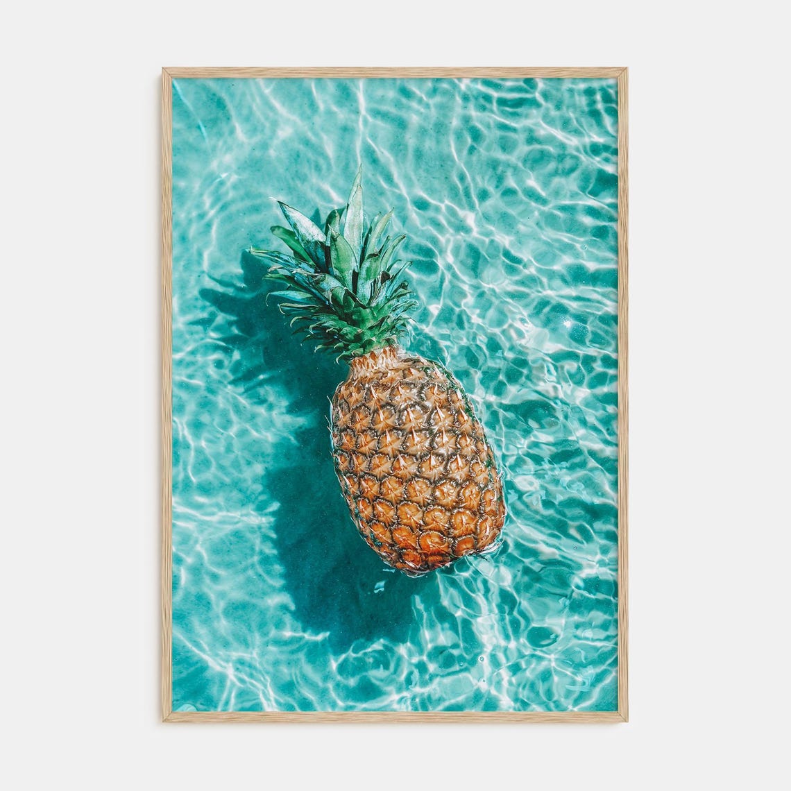 Ripe Pineapple Floating in Sparkling Turquoise Pool Water Poster