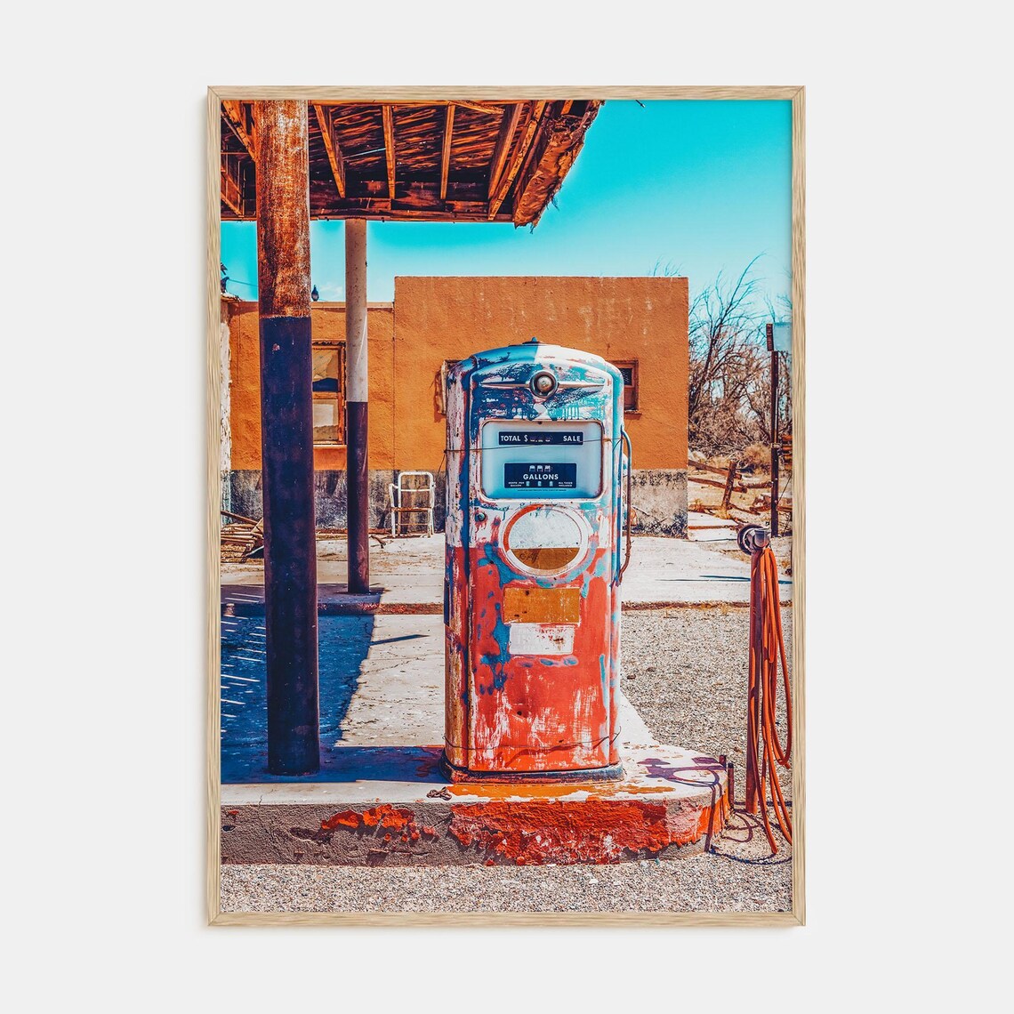 Vintage Red Gas Pump at an Abandoned Desert Gas Station Poster