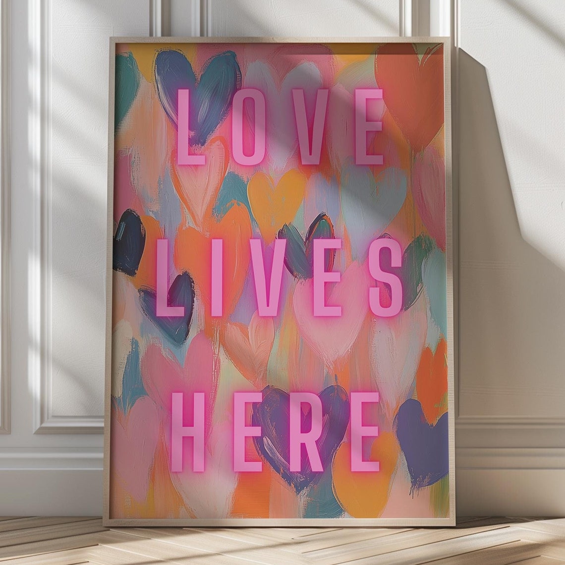 Love Lives Here in Glowing Pink Neon Over Painted Hearts Poster
