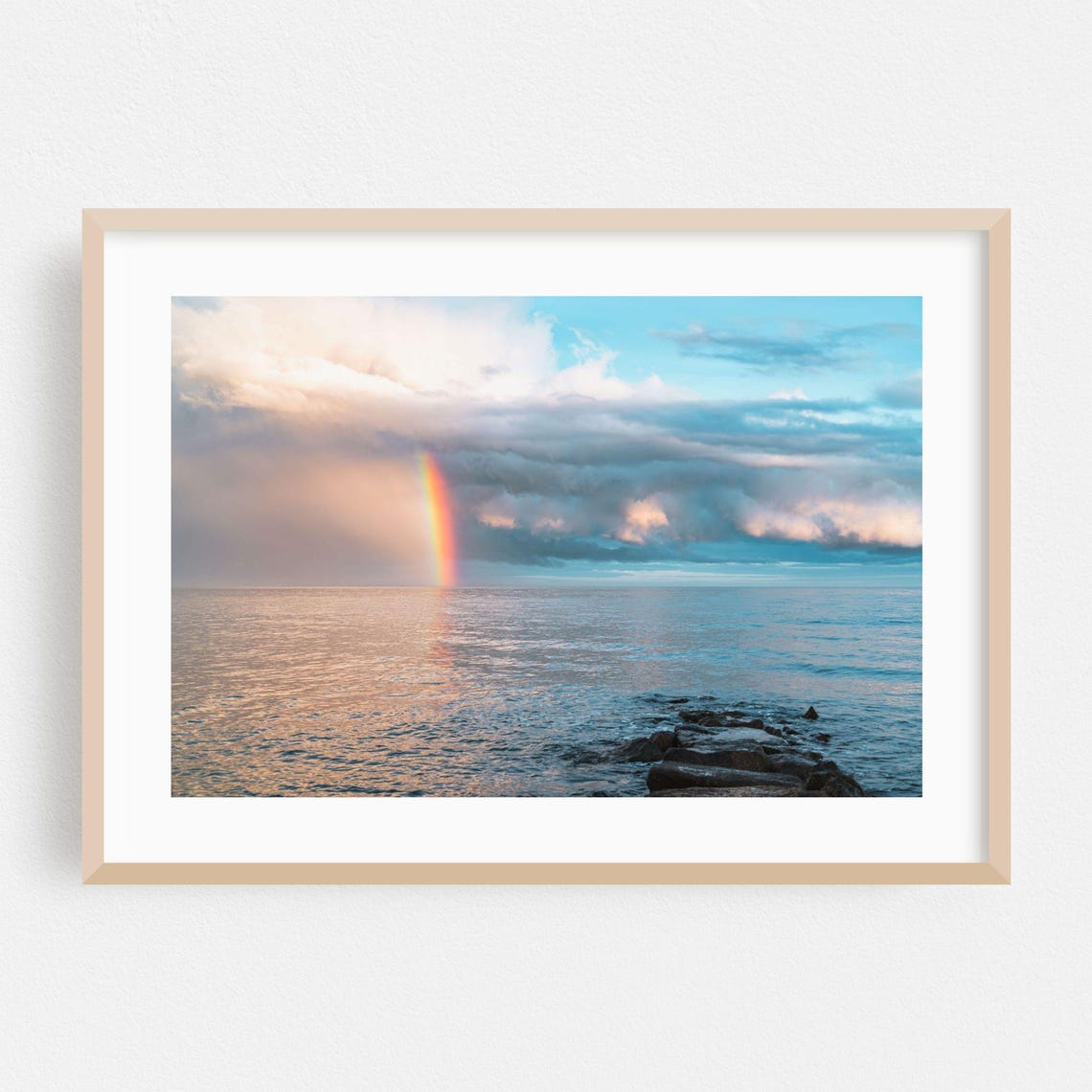Vivid Rainbow Over Calm Ocean With Rocky Shore At Sunset Poster