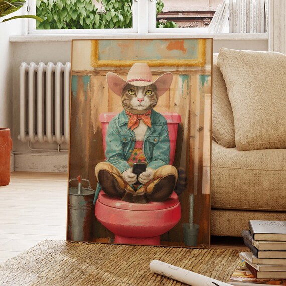 Cowboy Cat in Hat and Denim Jacket Sitting on a Pink Toilet Poster