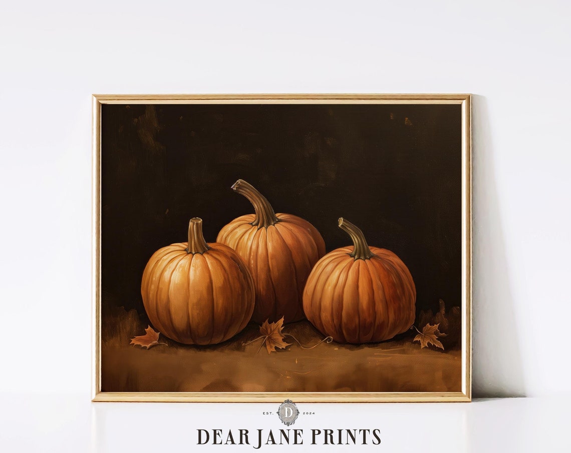 Three Orange Pumpkins On Dark Moody Background With Fall Leaves Poster - Image 2