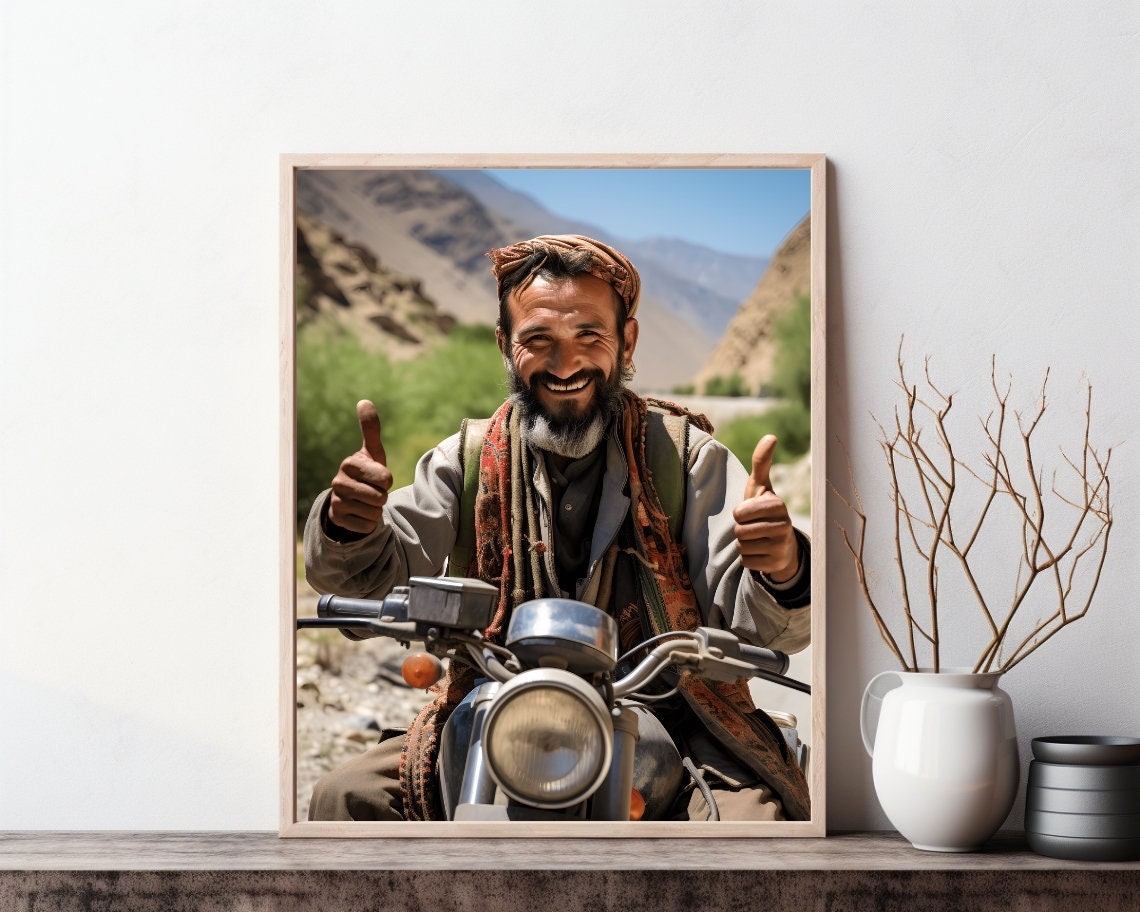 Smiling Afghan Man Giving Thumbs Up on Motorcycle Travel Poster