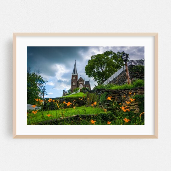 Harpers Ferry Stone Church on Hill with Orange Daylilies Poster