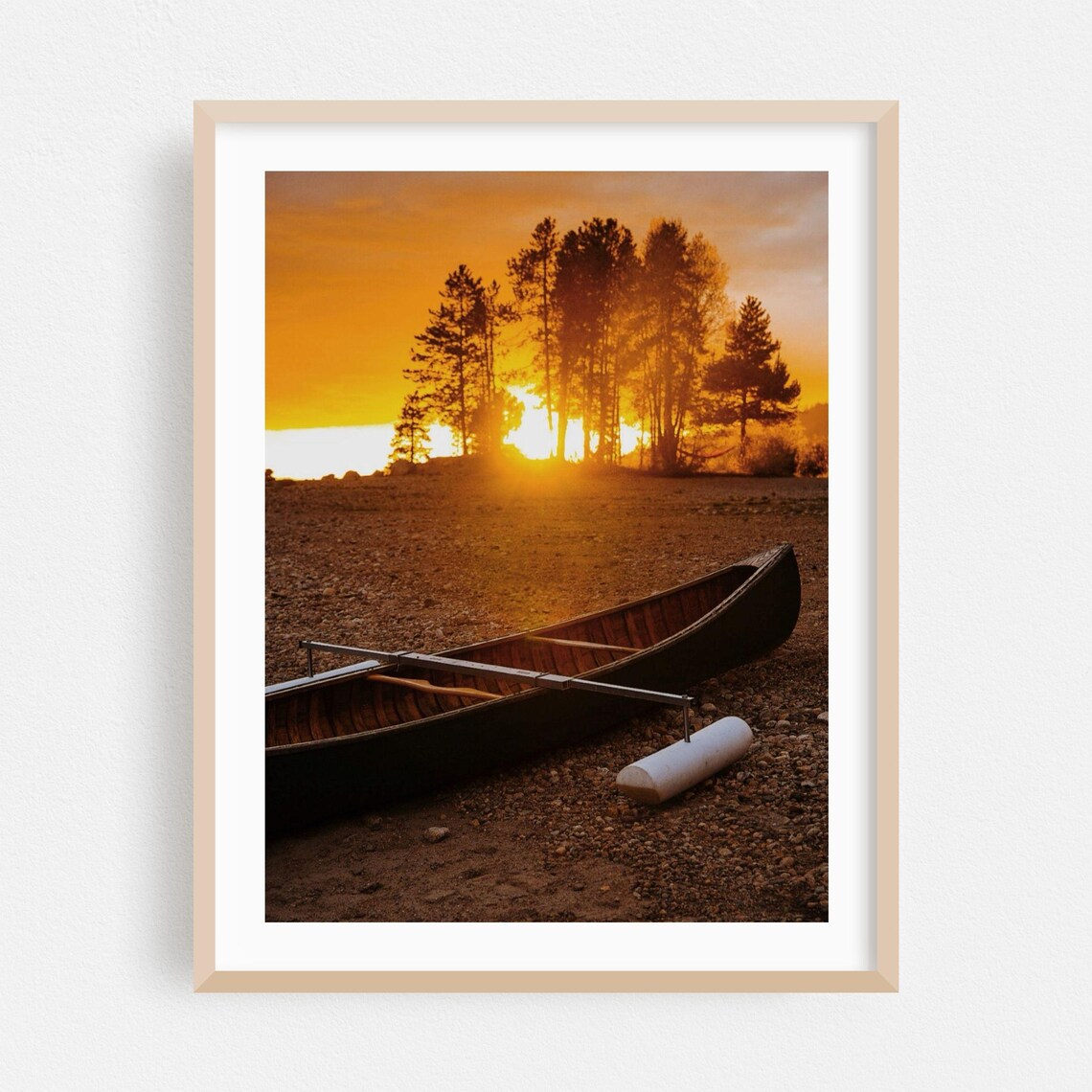 Wooden Canoe On Lakeshore At Sunset Behind Tall Pine Trees Poster