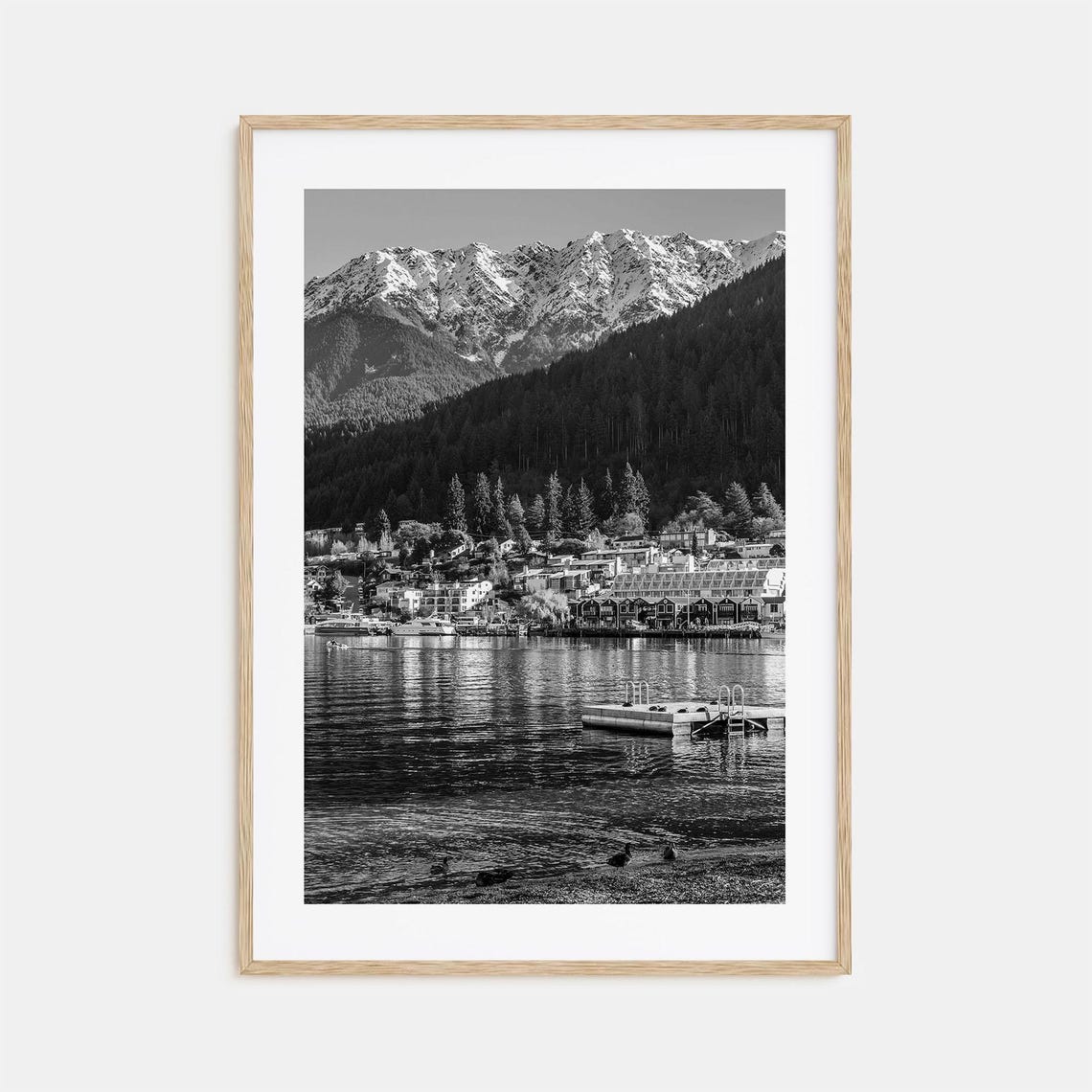 Black And White Alpine Lakeside Town Beneath Snowy Peaks Poster
