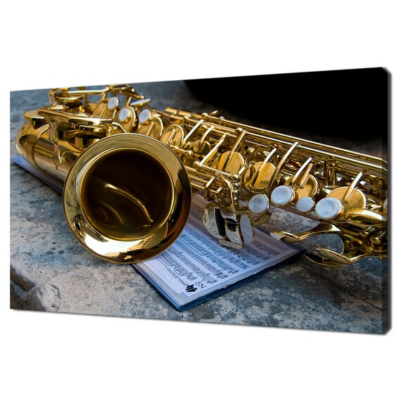 Golden Saxophone Resting on Sheet Music Jazz Instrument Photo Art Poster