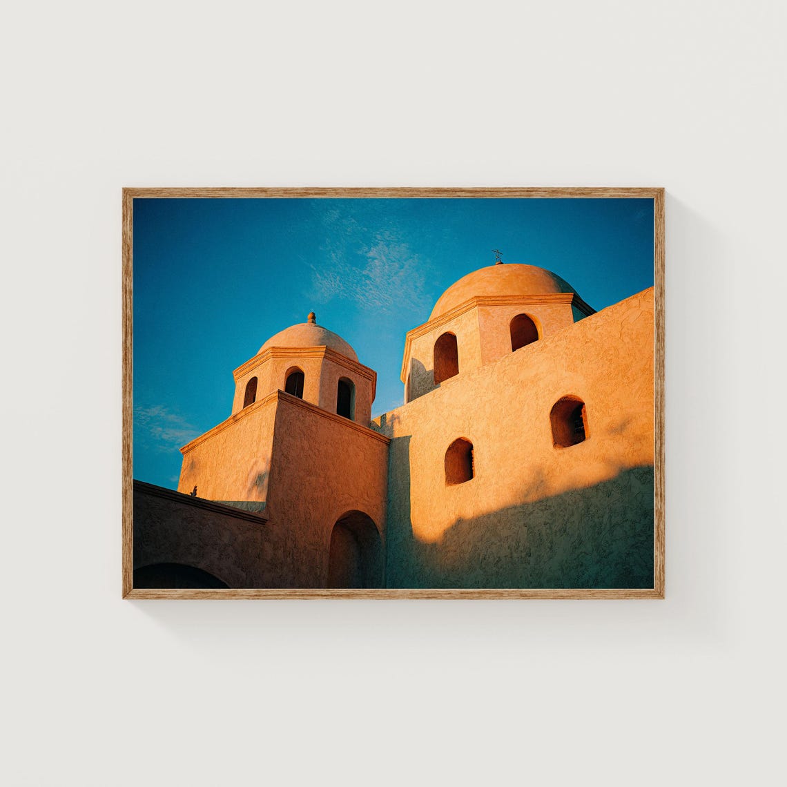 Sunlit Domed Terracotta Architecture Against Blue Sky Poster