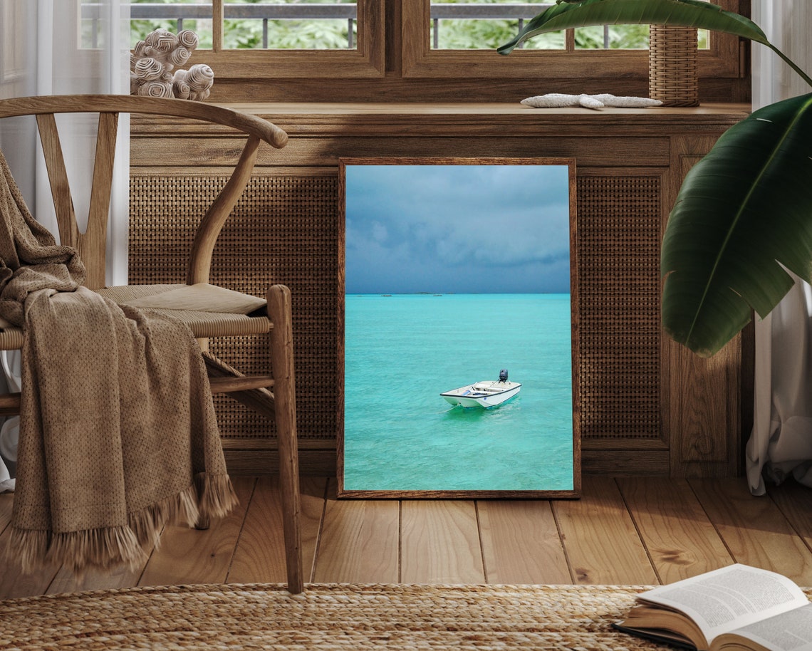 Lone White Motorboat on Vast Turquoise Sea Under Moody Sky Poster - Image 3