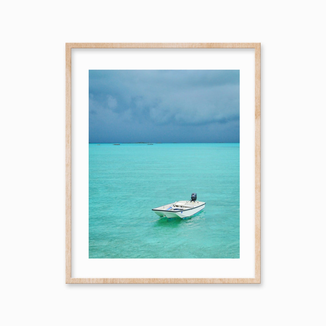 Lone White Motorboat on Vast Turquoise Sea Under Moody Sky Poster