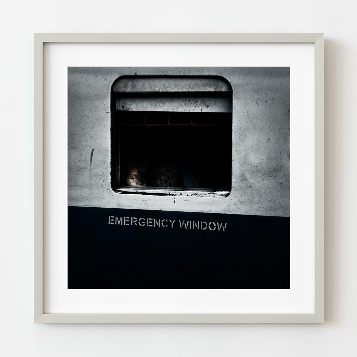 Curious Child Peeking Through Train Emergency Window Photo Poster