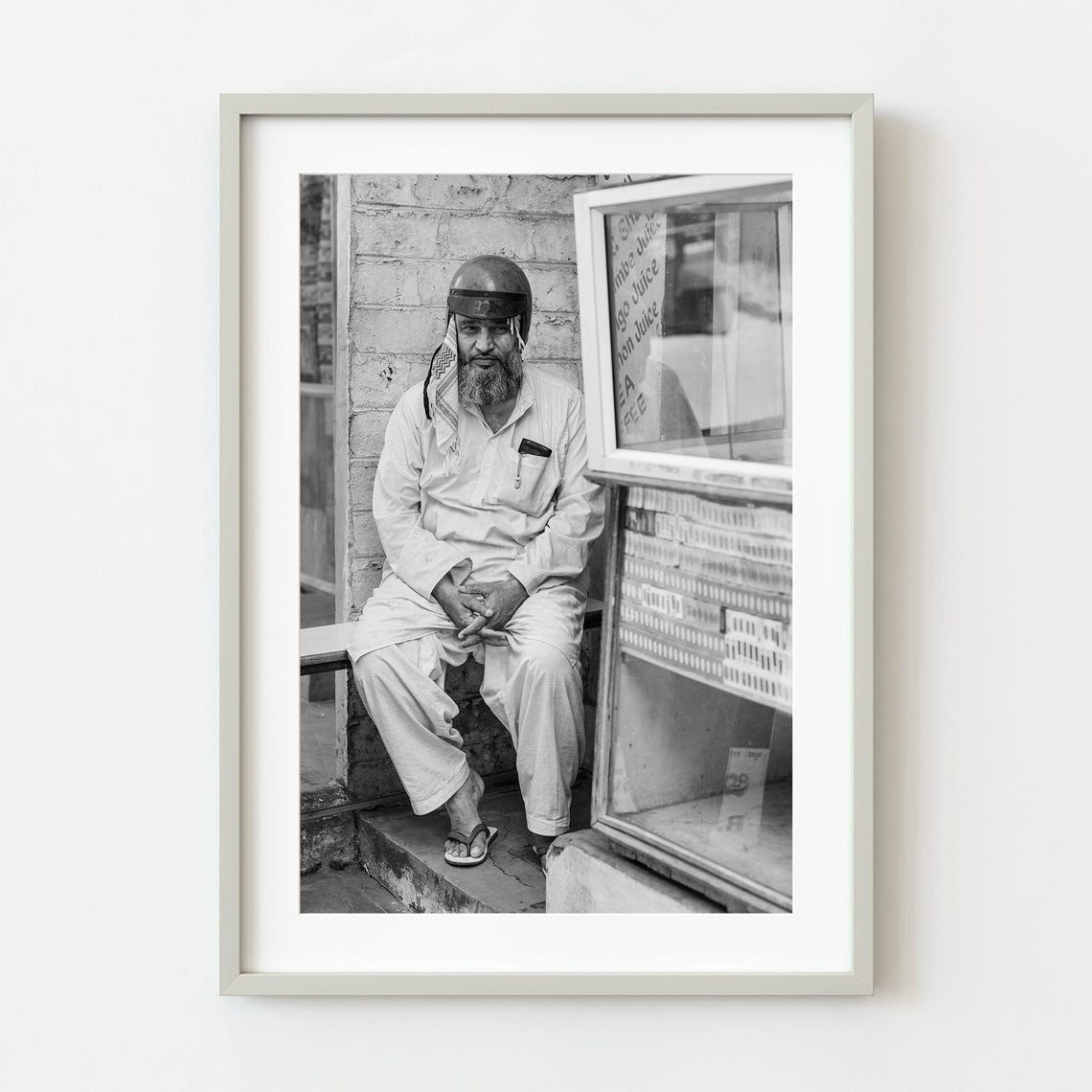 Man With Helmet By Juice Shop Black And White Street Photo Poster
