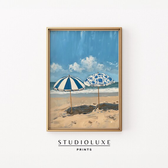 Two Blue And White Beach Umbrellas Standing On Sandy Shore Poster