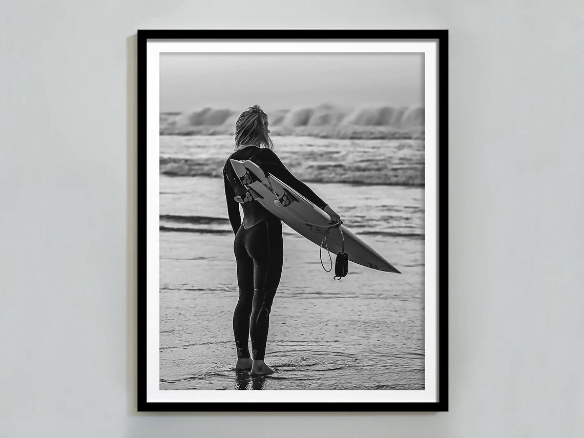 Woman in Wetsuit Holding Surfboard Watching Waves Beach Poster