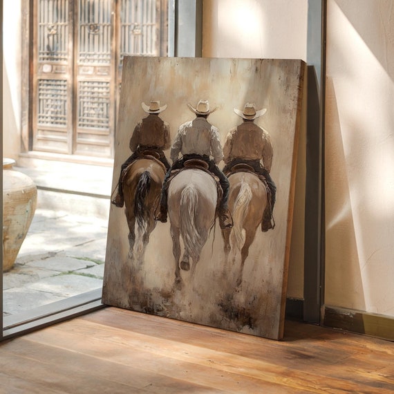Three Cowboys Riding Into The Dust On Horseback A Rustic Western Scene Capturing The Spirit Of The Wild West In Neutral Tones