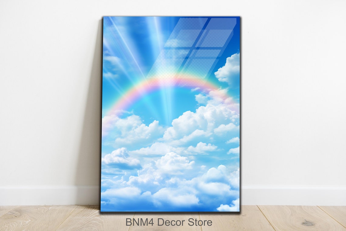 Vibrant Rainbow Over Blue Sky White Clouds and Radiant Sunbeam Poster