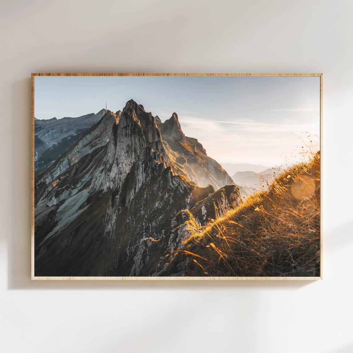 Dramatic Alpine Rocky Peaks Bathed in Warm Evening Light Poster
