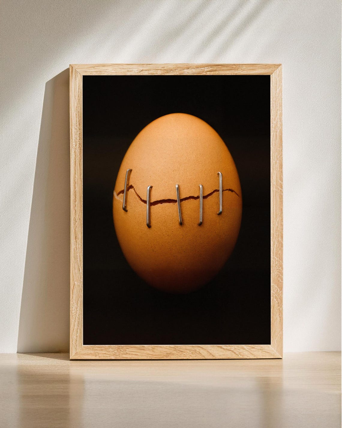 Cracked Egg Held Together by Staples Healing Resilience Art Poster