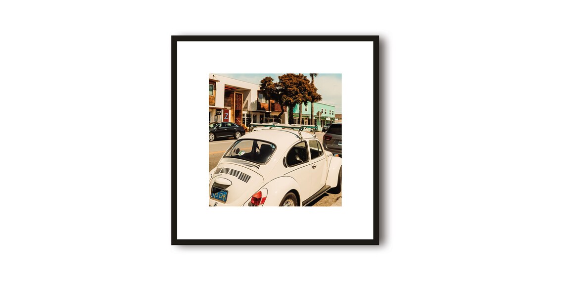 White Volkswagen Beetle Parked on a Sunny California Street Poster