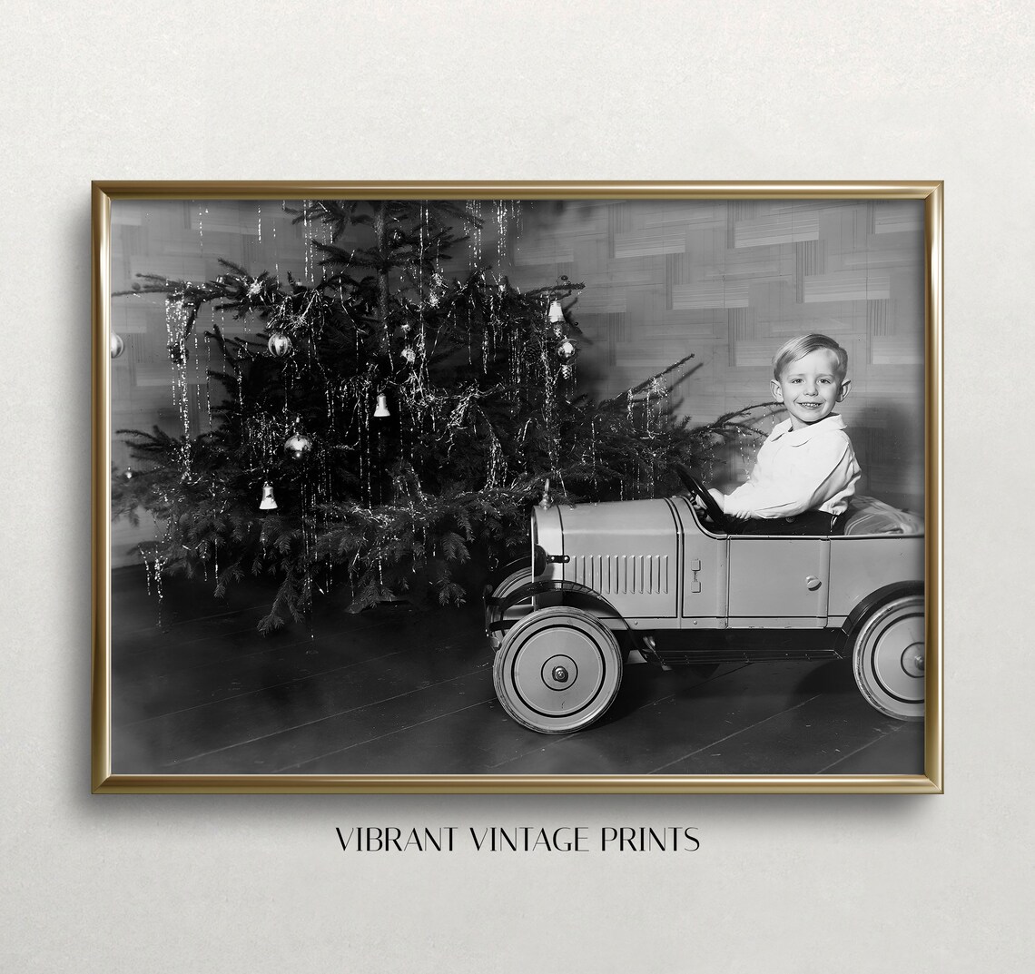 Boy In Toy Pedal Car By Christmas Tree Black And White Photo Print
