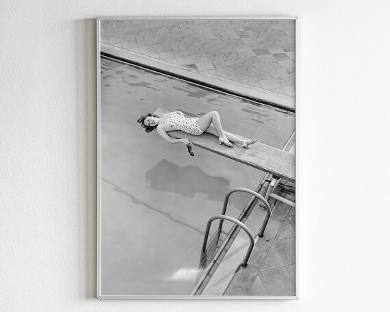 Vintage Black and White Photo of a Woman Lounging on a Diving Board Poster