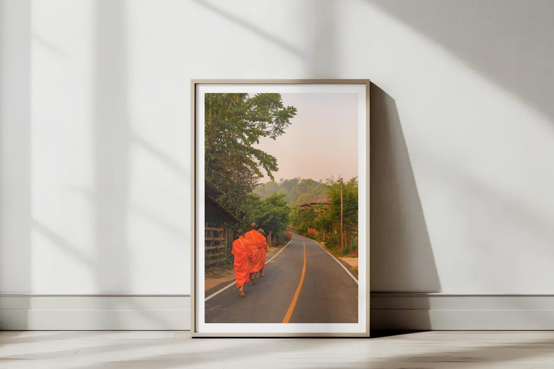 Buddhist Monks in Orange Robes Walking at Sunrise Morning Poster