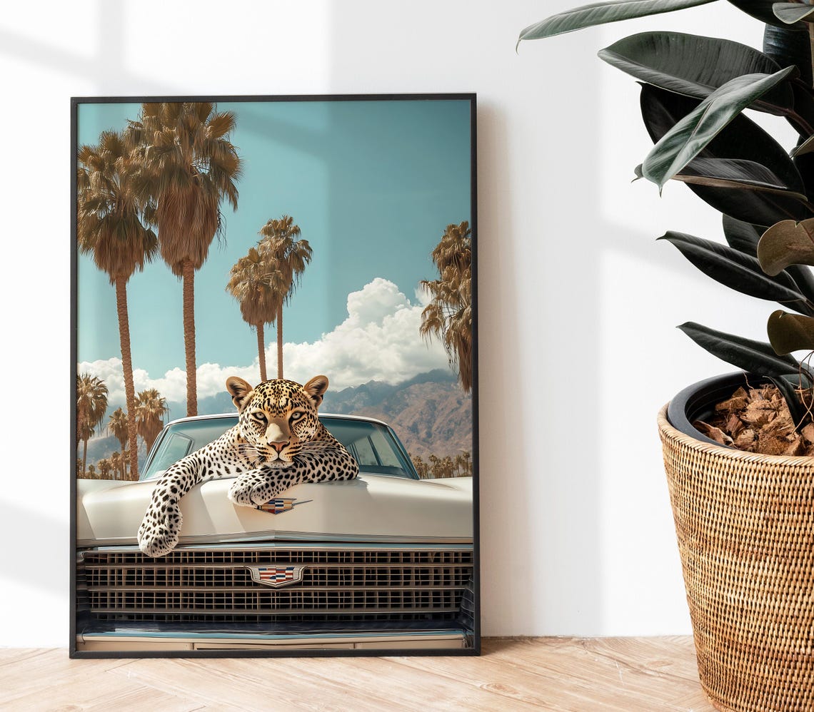 Leopard Draped Over White Cadillac Hood Beneath Palm Trees Poster - Image 2