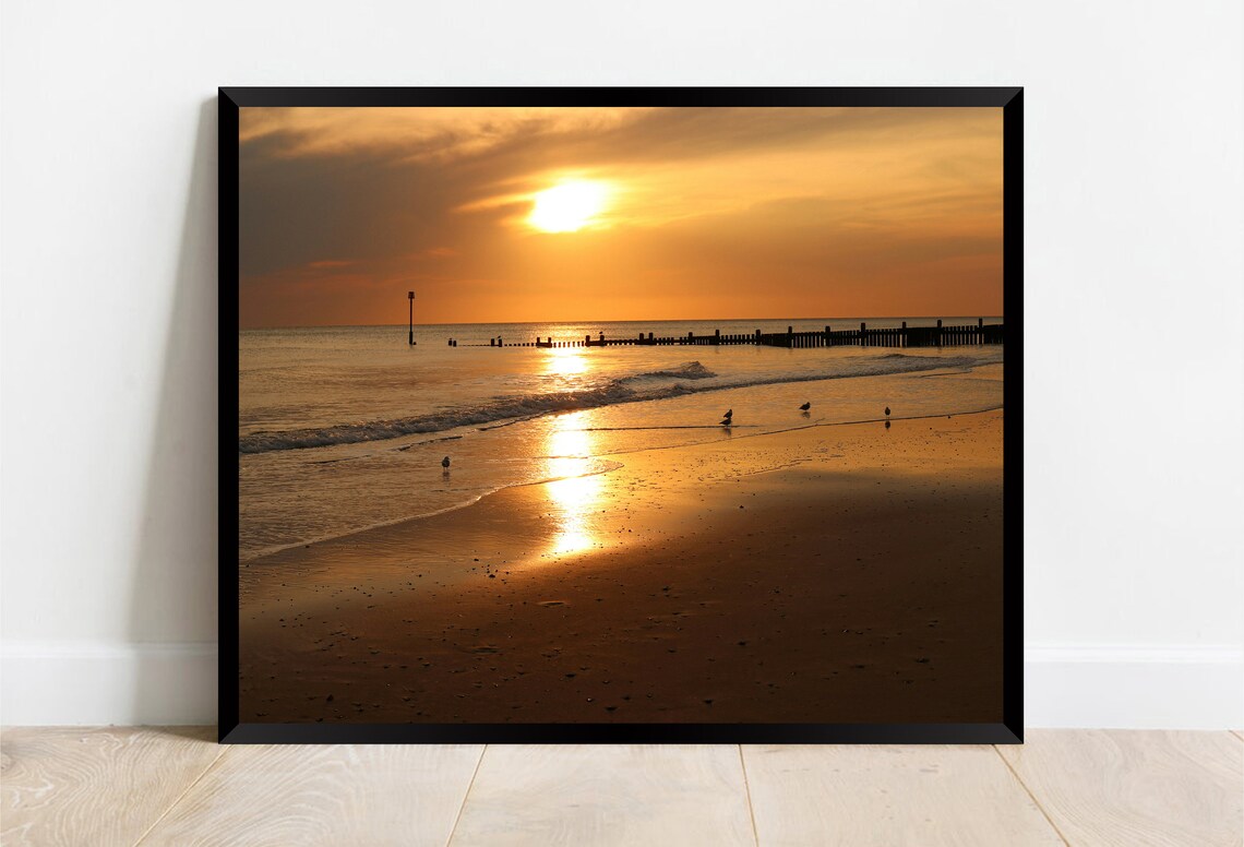 Golden Sunrise Over Calm Beach Wooden Groynes and Birds Poster - Image 2