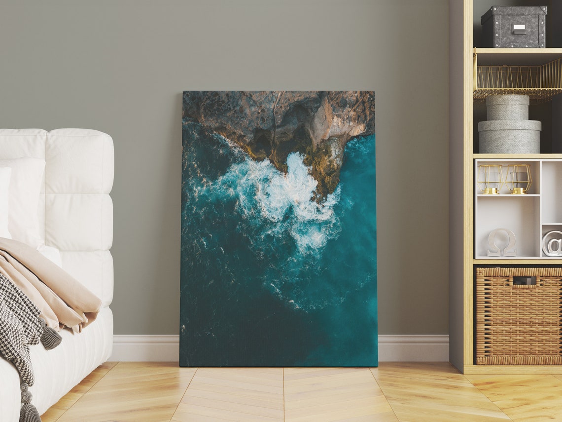 Aerial View of Turquoise Ocean Waves Crashing on Rocky Coast Poster - Image 3