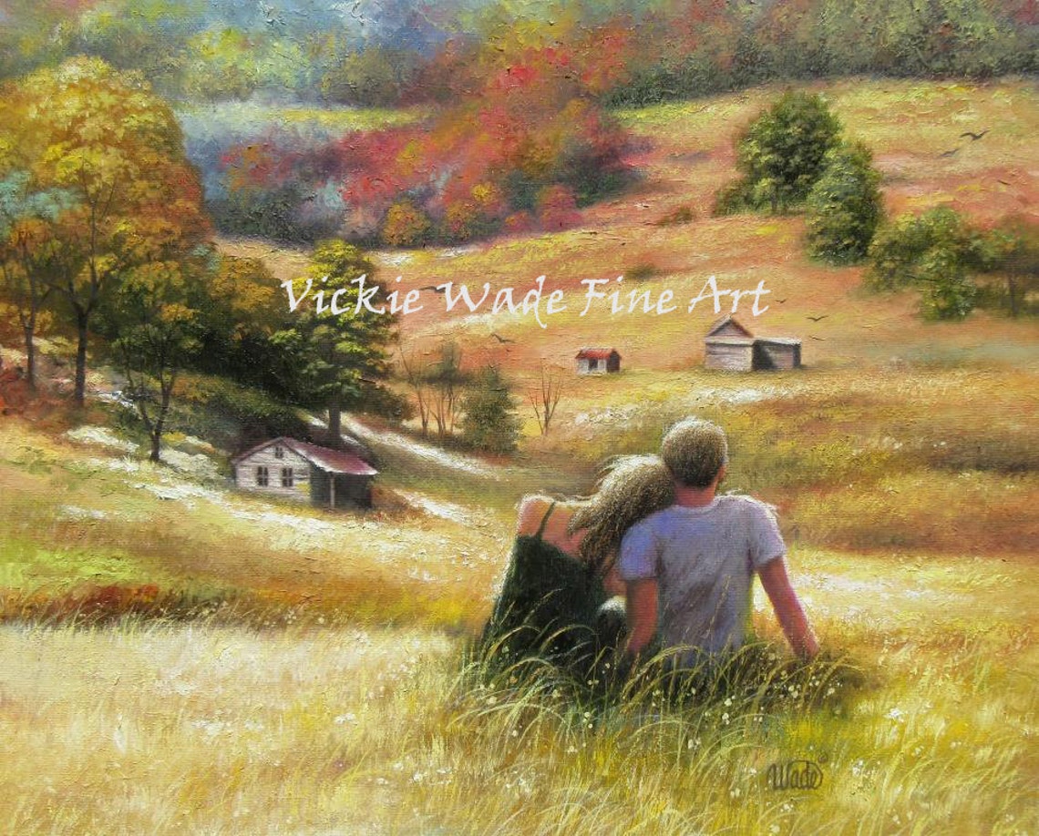 Couple Sitting in a Wheat Field Overlooking an Autumn Valley Poster
