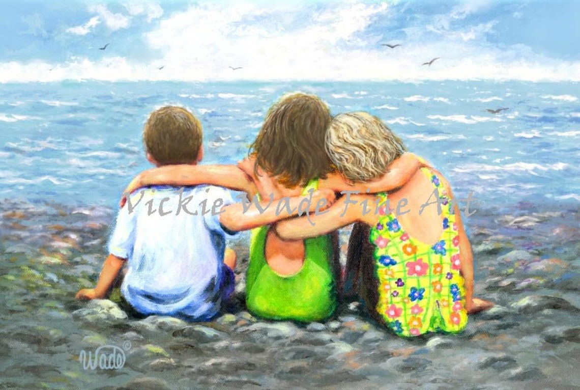 Three Children Hugging While Sitting On Rocks By The Ocean Poster