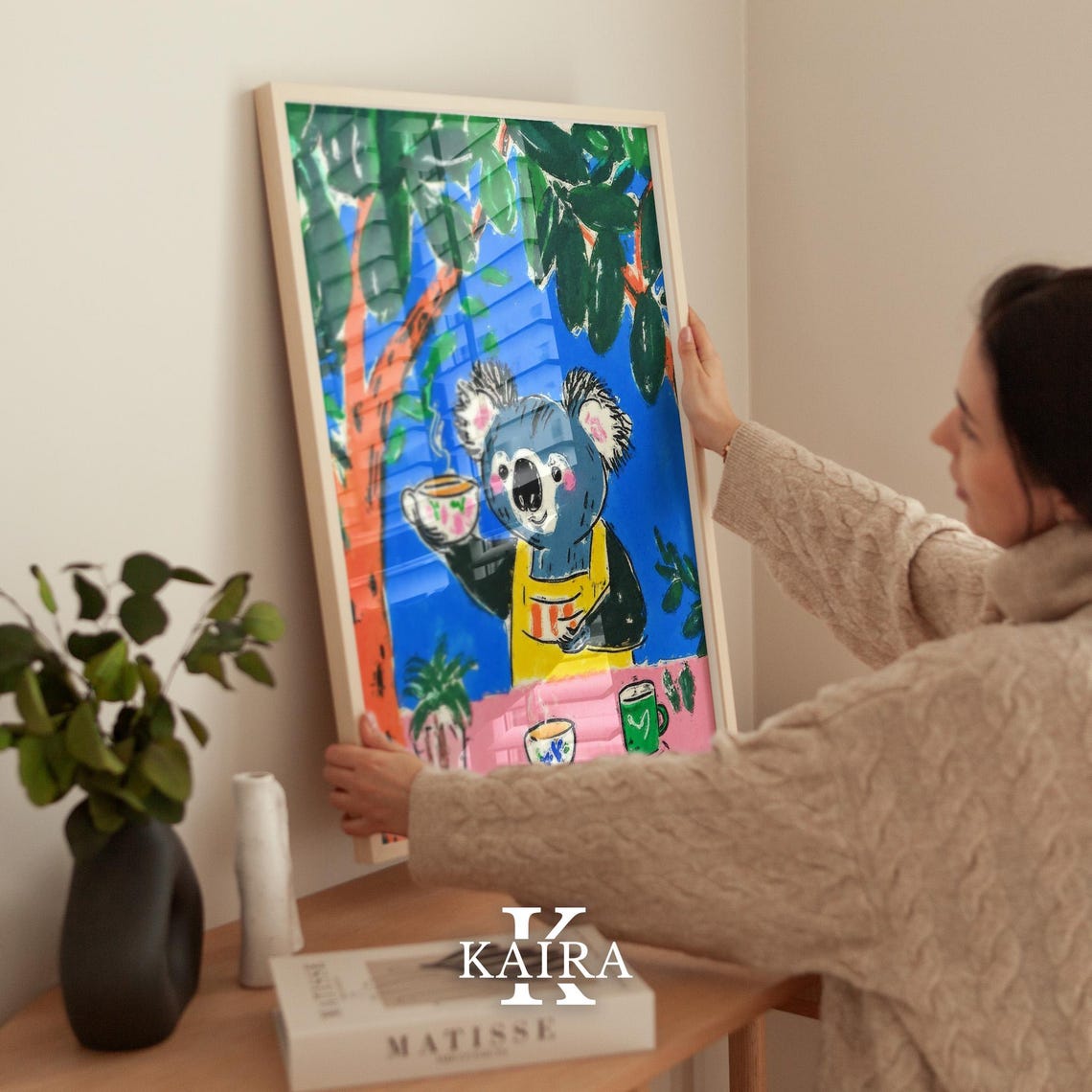 Friendly Koala in a Yellow Apron Serving Tea Under a Tree Poster - Image 2