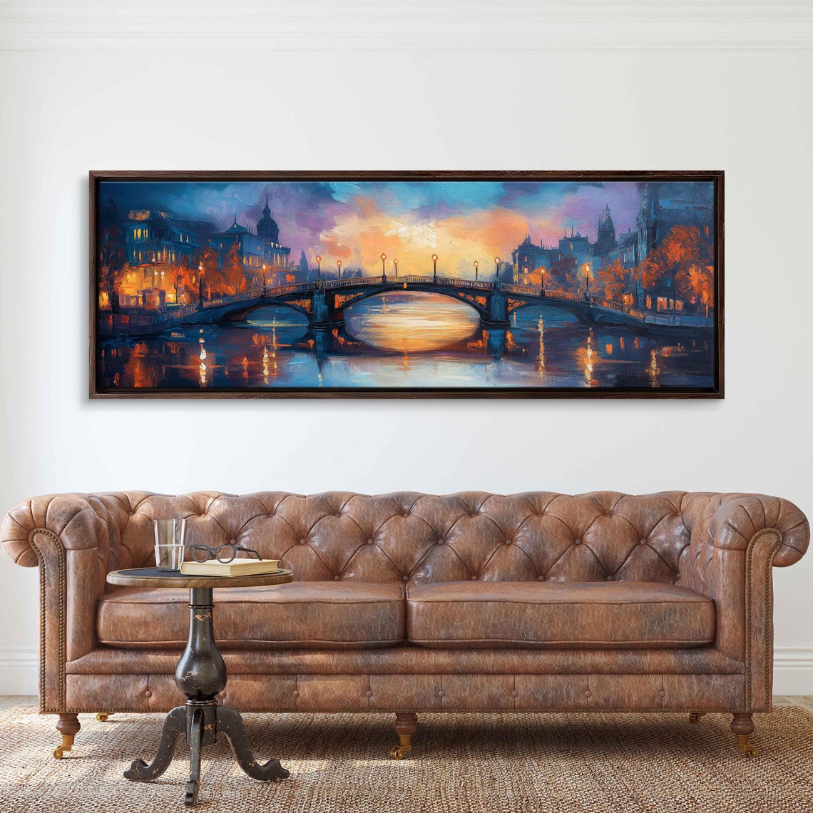 Arched Bridge Over Calm River At Dusk With City Lights Poster