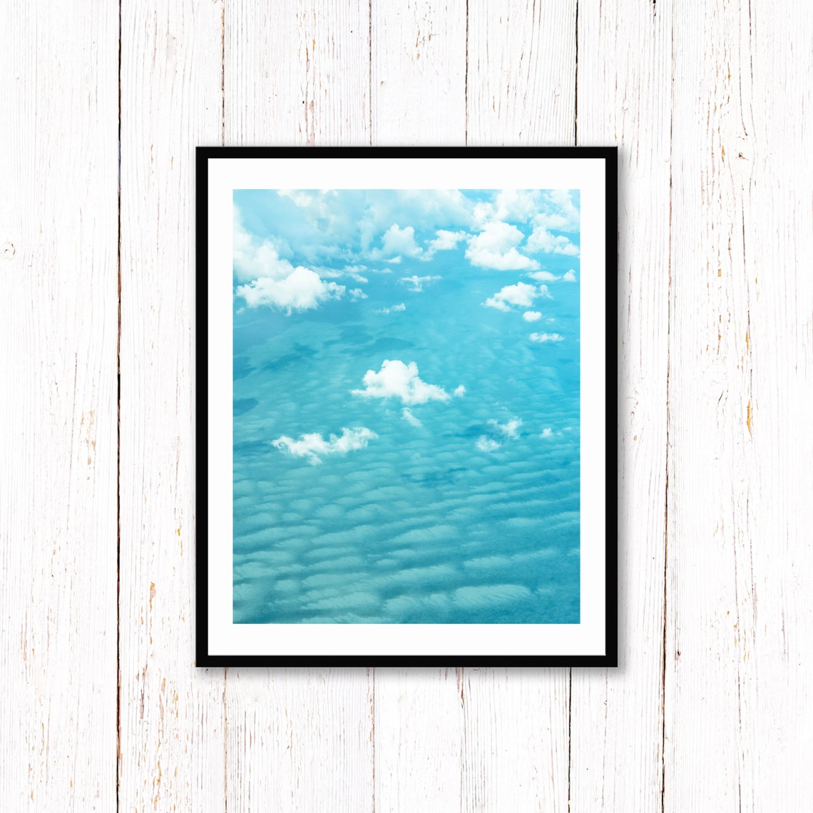 White Clouds Drifting Over a Bright Turquoise Ocean Surface Poster - Image 2