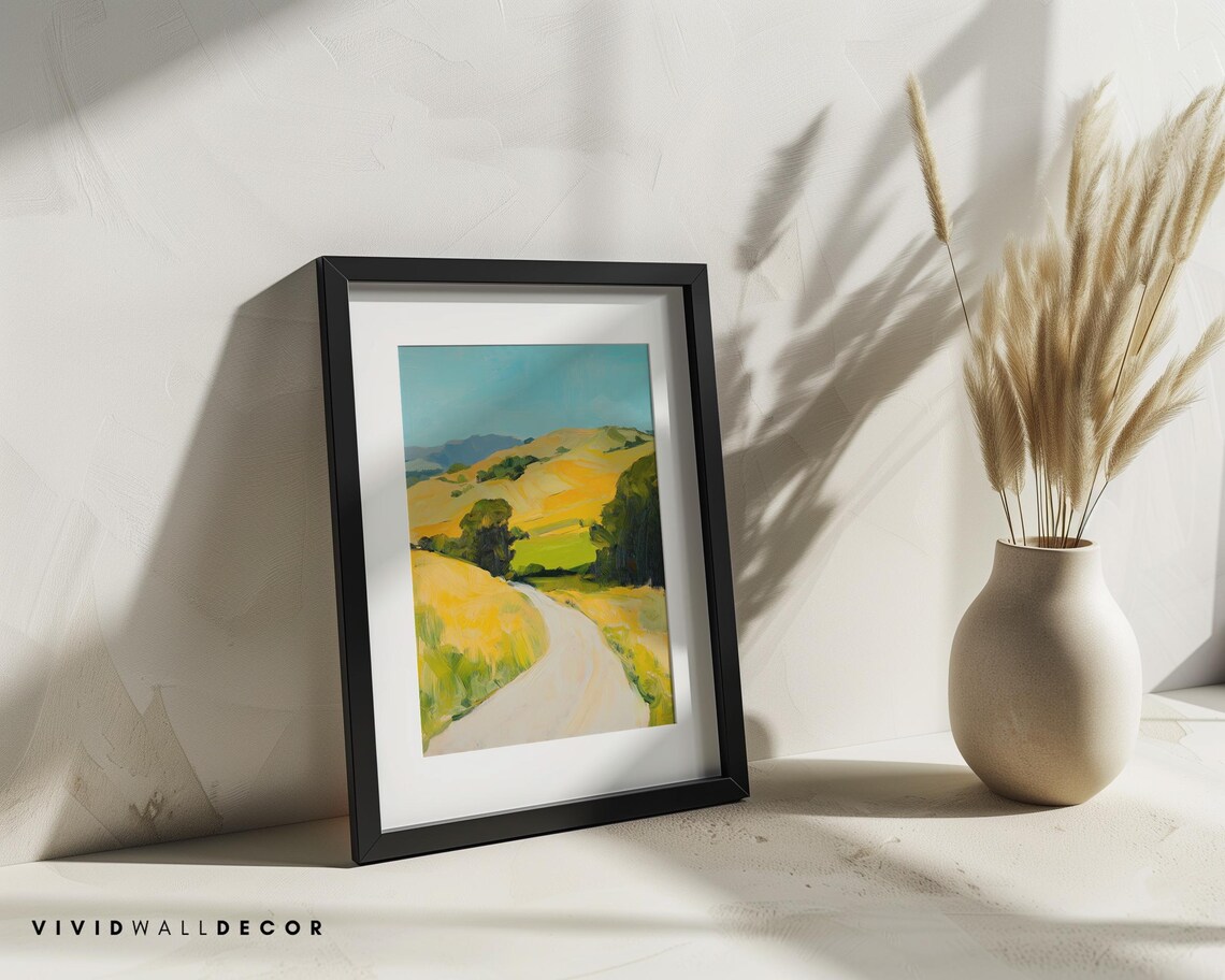 Sunlit Country Road Through Rolling Golden Hills Landscape Poster - Image 2