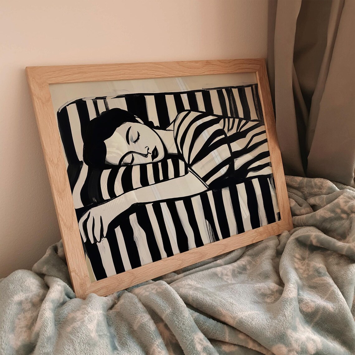Reclining Monochrome Woman Sleeping Wrapped In Bold Stripes Print - Image 3