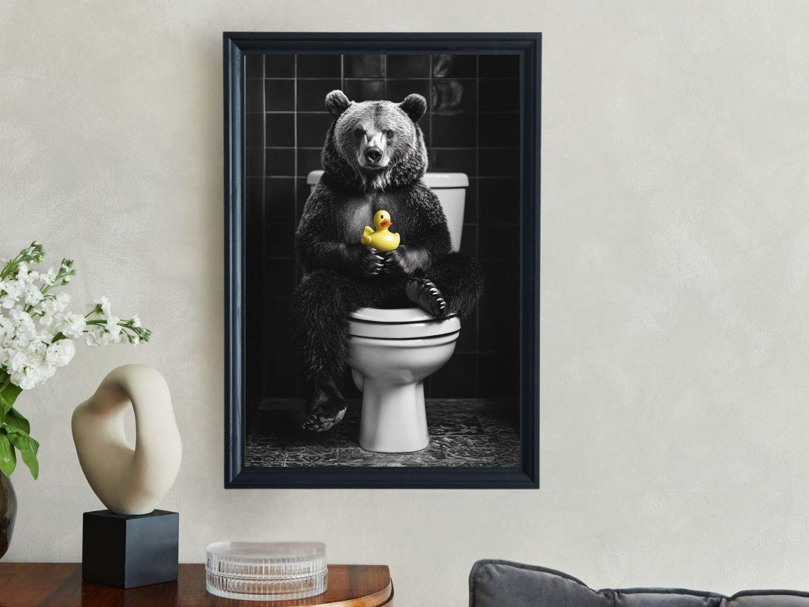 Bear Sitting On A Toilet Holding A Yellow Rubber Duck Poster