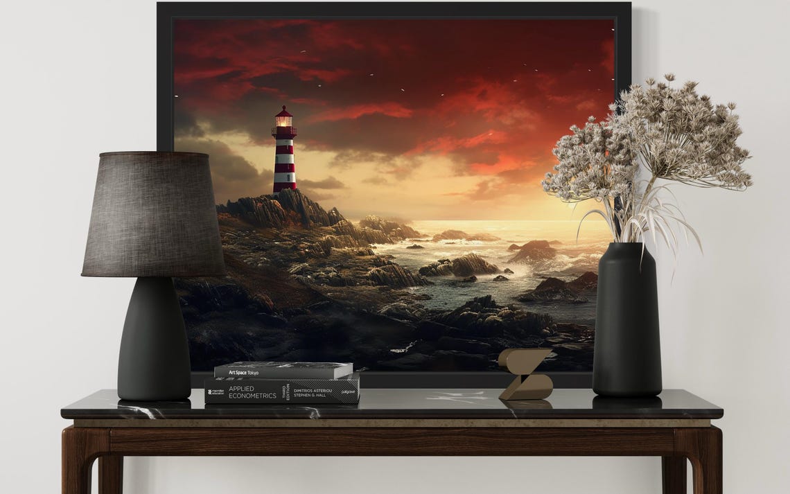 Striped Lighthouse on Rocky Coast Under Fiery Red Sunset Sky Poster - Image 3