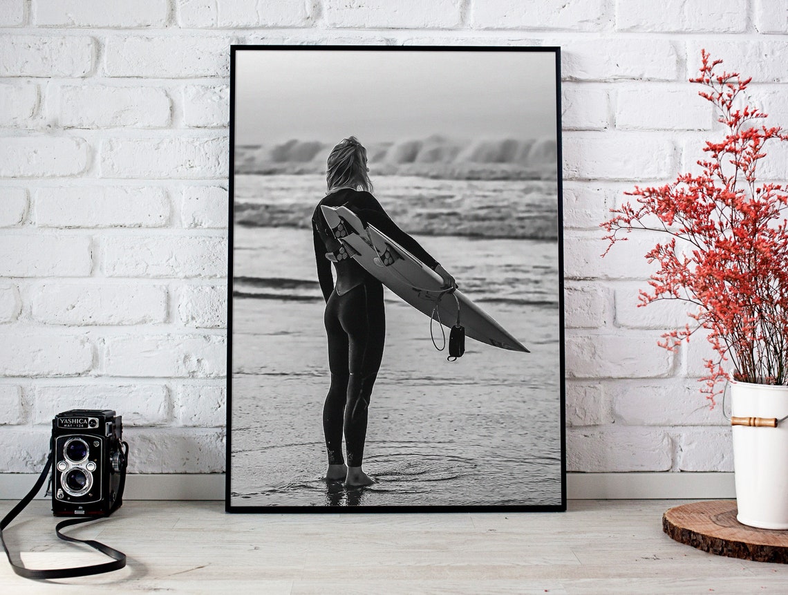 Woman in Wetsuit Holding Surfboard Watching Waves Beach Poster - Image 2