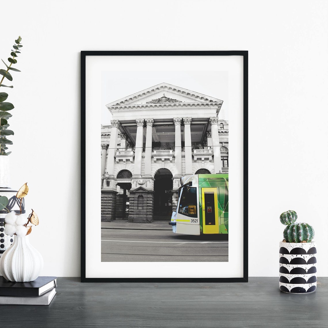 Melbourne Town Hall Columned Facade With Green and Yellow Tram Poster