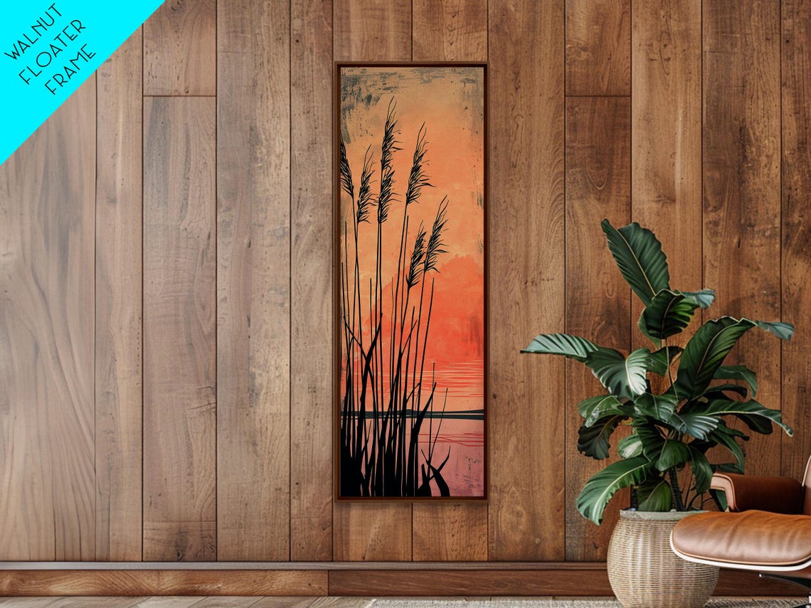 Black Reeds Silhouetted Against Glowing Orange Sunset Sky Art Poster