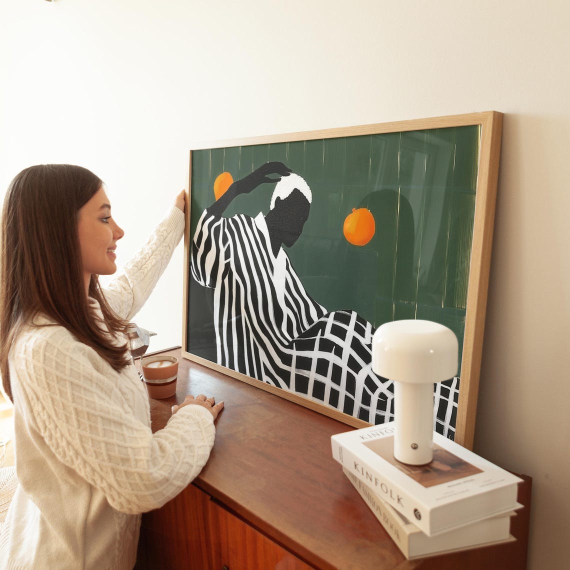 Figure in Stripes and Checks Reaching Toward Orange Suns Poster
