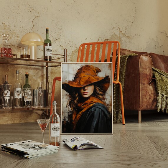 Cowgirl In Amber Hat Rust Scarf Dark Coat Dramatic Western Portrait Poster